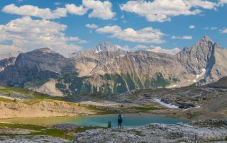 Hiker viewing Yellow Lake and Mount Leval